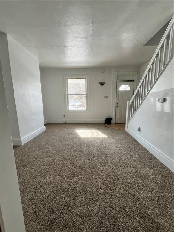 entryway with carpet floors