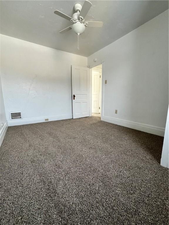 unfurnished room featuring ceiling fan