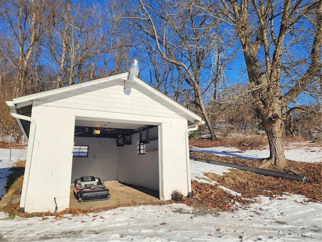 view of snow covered garage