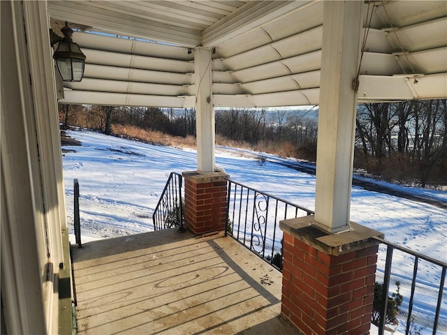 view of snow covered deck