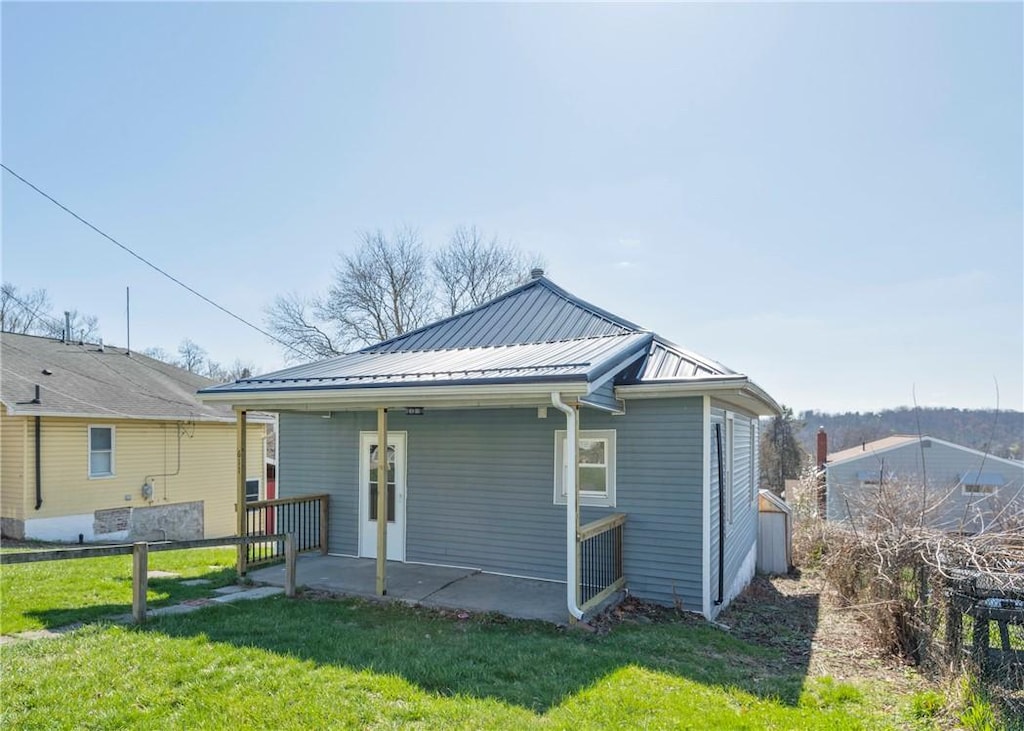 611 Penn Ave, City Of Washington, PA 15301 - back of house featuring a yard, a standing seam roof, metal roof, and a patio