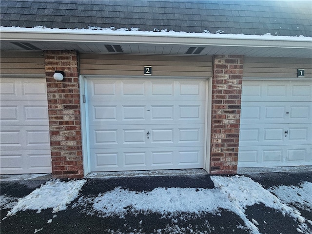 view of snow covered garage