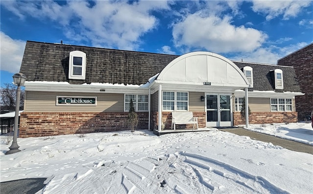 view of snow covered house