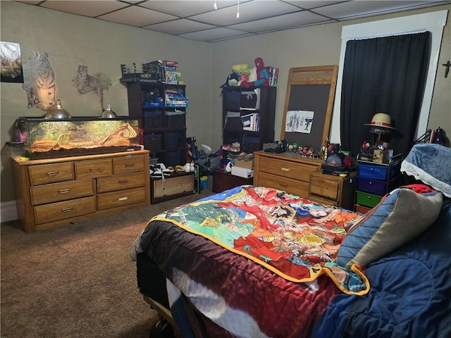 carpeted bedroom with a drop ceiling