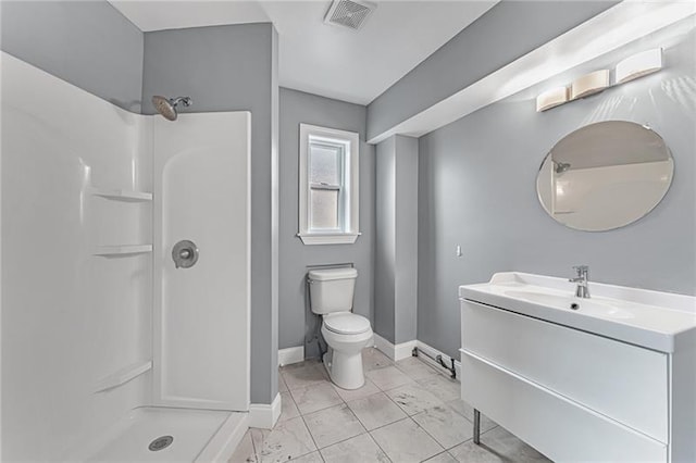 bathroom with walk in shower, vanity, and toilet