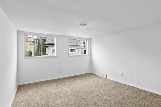 unfurnished room with carpet flooring