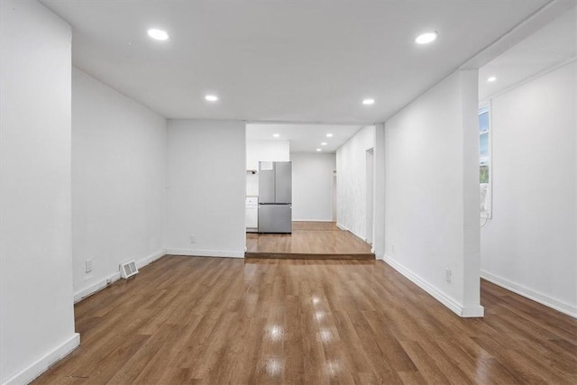 unfurnished living room with hardwood / wood-style flooring