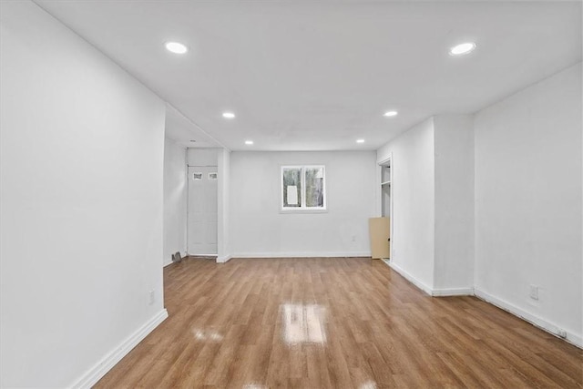 basement featuring light hardwood / wood-style floors