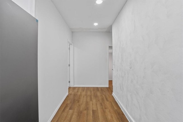 corridor featuring hardwood / wood-style floors