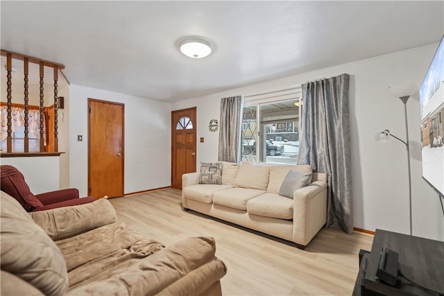 living room with light hardwood / wood-style flooring