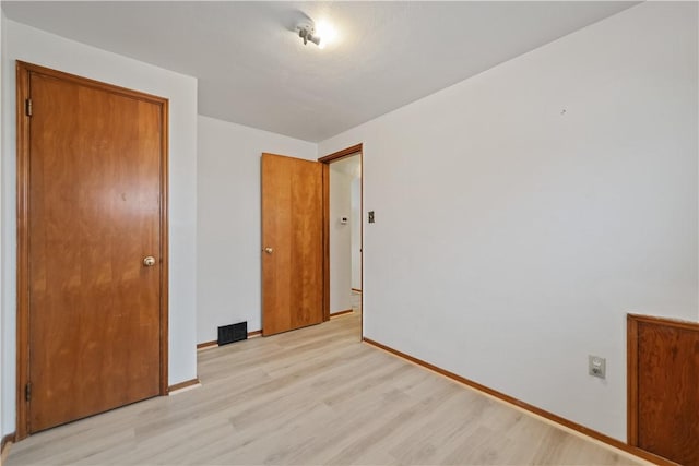 unfurnished bedroom with light hardwood / wood-style floors