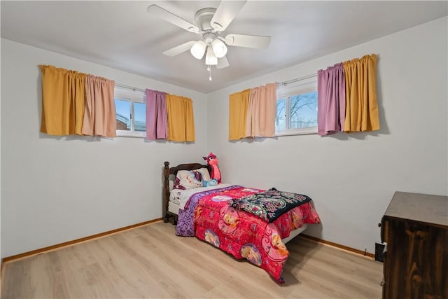 bedroom featuring light wood-type flooring and ceiling fan