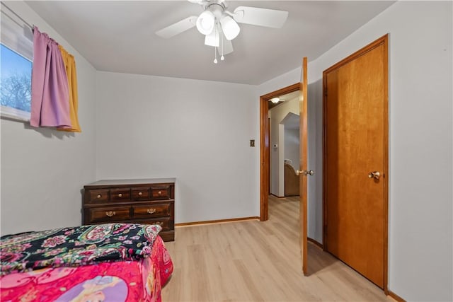 bedroom with ceiling fan and light wood-type flooring