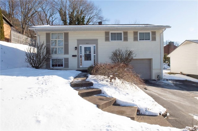 split foyer home featuring a garage