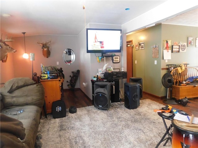 living room featuring wood finished floors and baseboards