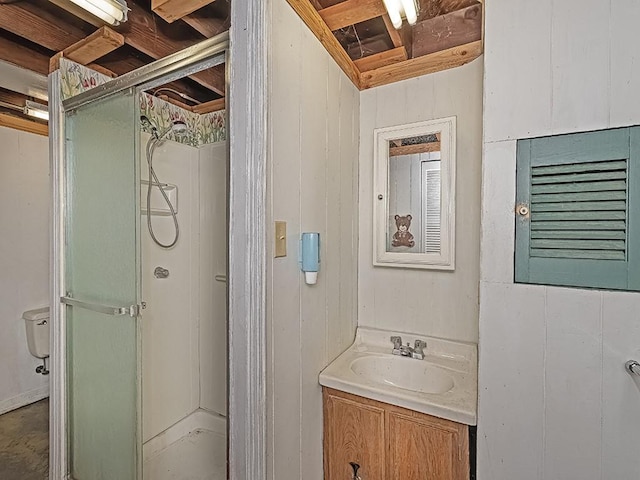 bathroom with an enclosed shower, vanity, and toilet