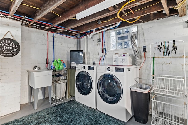 washroom with washer and dryer