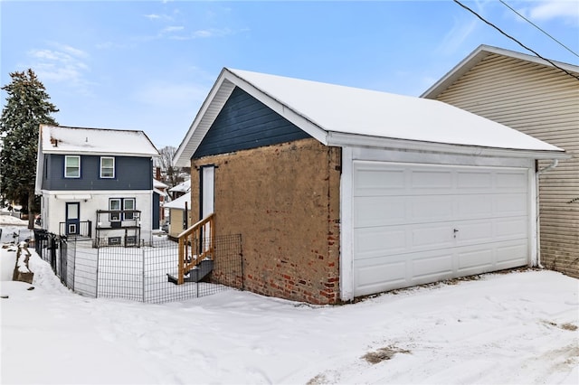 view of snow covered garage