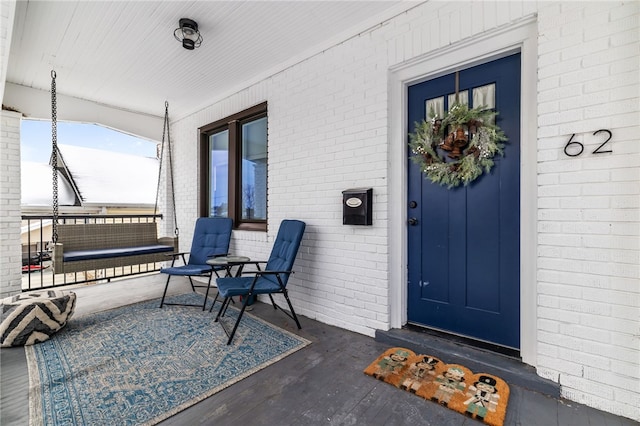 doorway to property with a porch