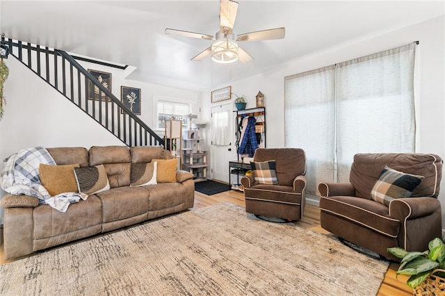 living room with hardwood / wood-style floors and ceiling fan