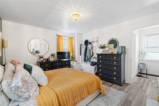 bedroom with light hardwood / wood-style floors