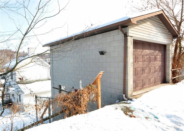 view of snow covered garage