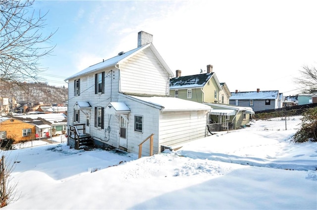 view of snow covered house