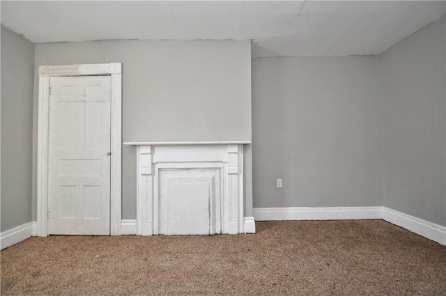 unfurnished living room with carpet