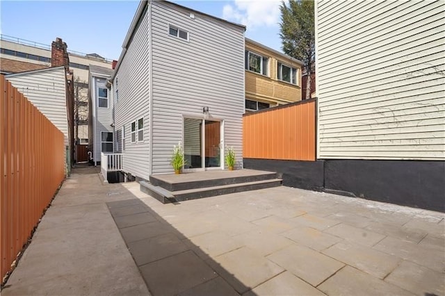 rear view of property featuring a patio area