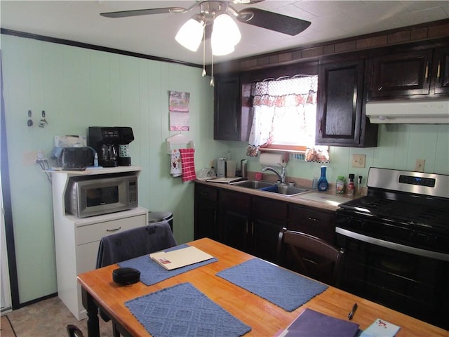 kitchen with extractor fan, sink, ceiling fan, and appliances with stainless steel finishes