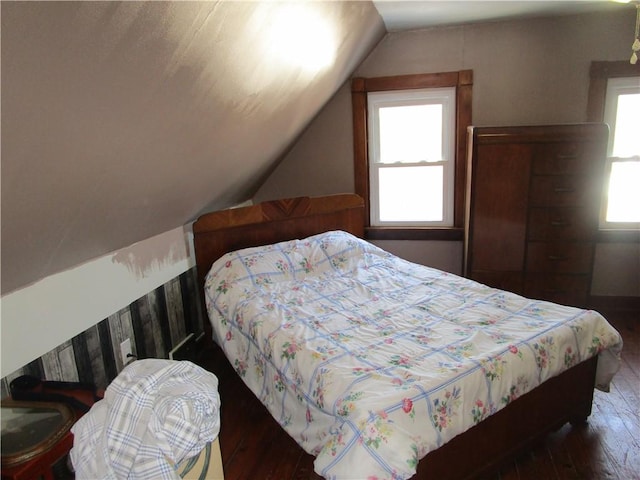 bedroom featuring dark hardwood / wood-style floors and vaulted ceiling