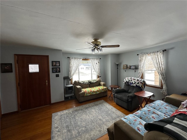 living room with wood-type flooring and ceiling fan