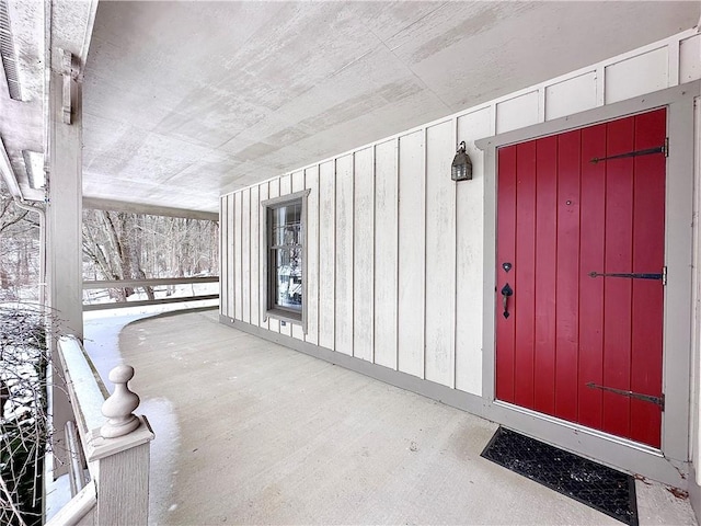 view of snow covered property entrance