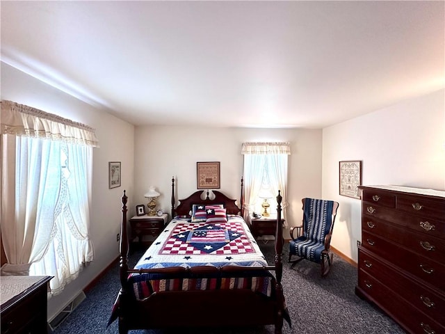 bedroom with dark carpet