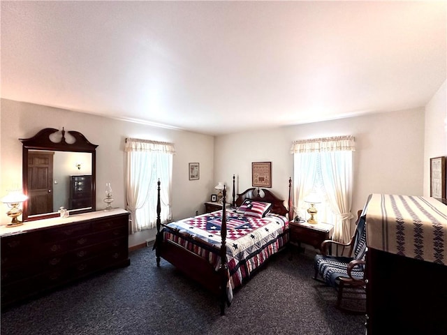 bedroom featuring dark colored carpet