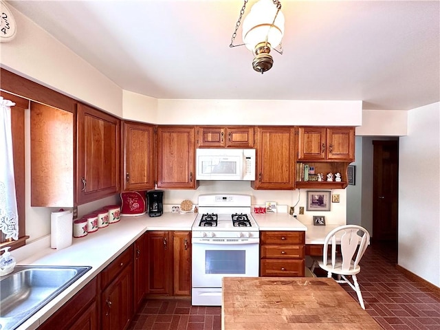 kitchen with sink and white appliances