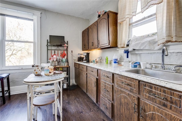 kitchen featuring sink and dark hardwood / wood-style floors