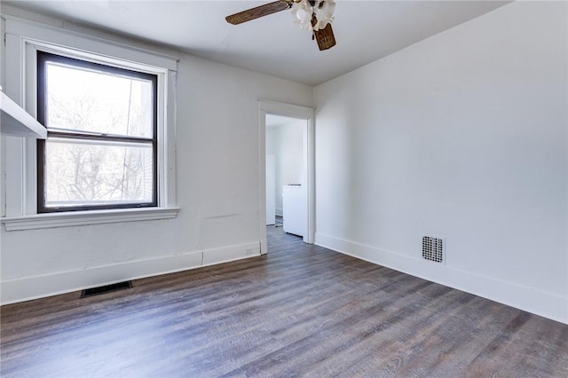 spare room featuring ceiling fan and dark hardwood / wood-style flooring