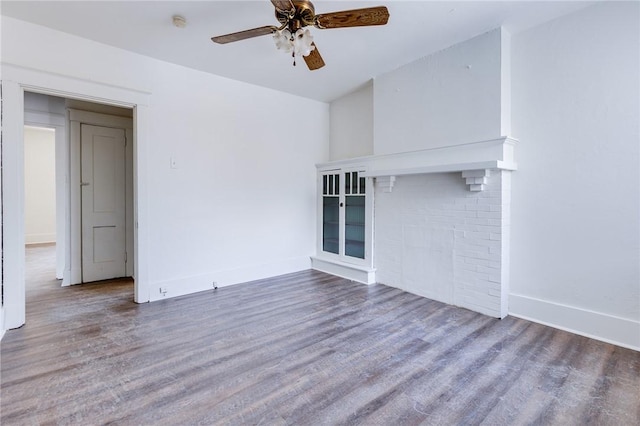 empty room featuring hardwood / wood-style flooring and ceiling fan