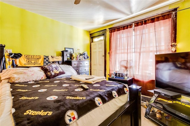 carpeted bedroom with ceiling fan