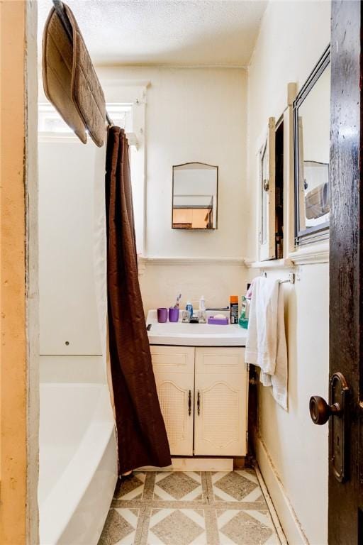 bathroom with vanity and shower / bath combo with shower curtain