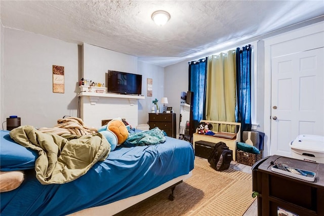 bedroom featuring a textured ceiling