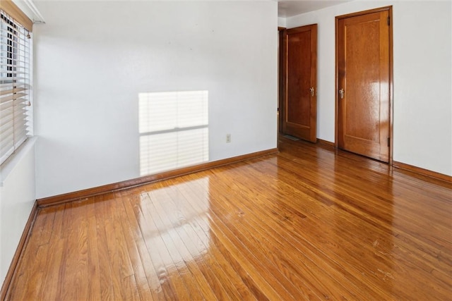 unfurnished room with light hardwood / wood-style floors