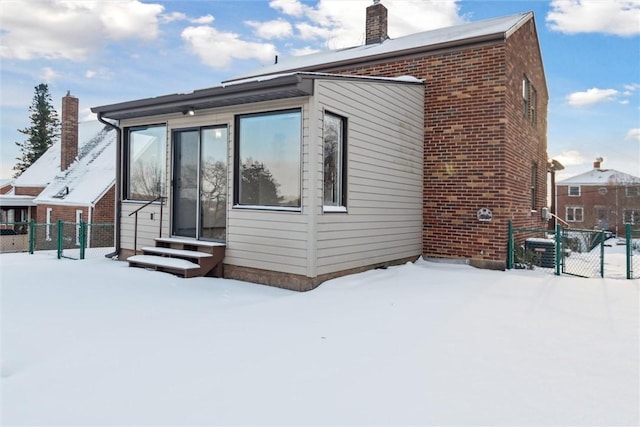 view of snow covered house