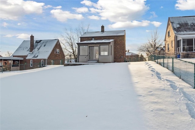 view of snow covered house