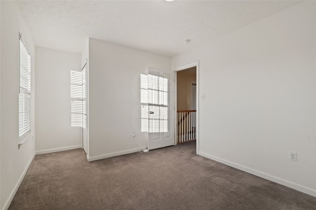 unfurnished room with carpet