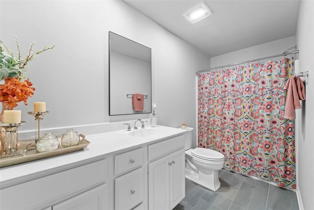 bathroom featuring toilet, tile patterned floors, a shower with curtain, and vanity