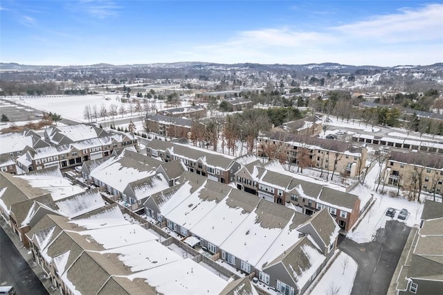 snowy aerial view featuring a residential view