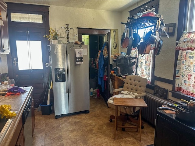 kitchen featuring stainless steel appliances and radiator heating unit