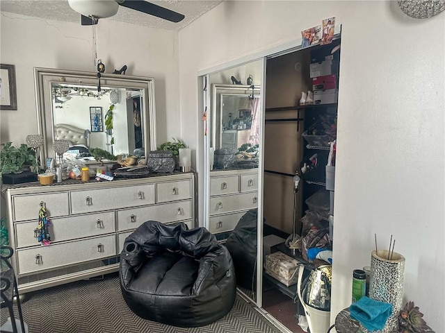 interior space with ceiling fan